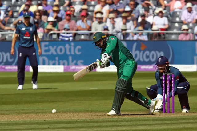 Pakistan's Asif Ali (C) plays a shot during the third One Day International (ODI) cricket match between England and Pakistan