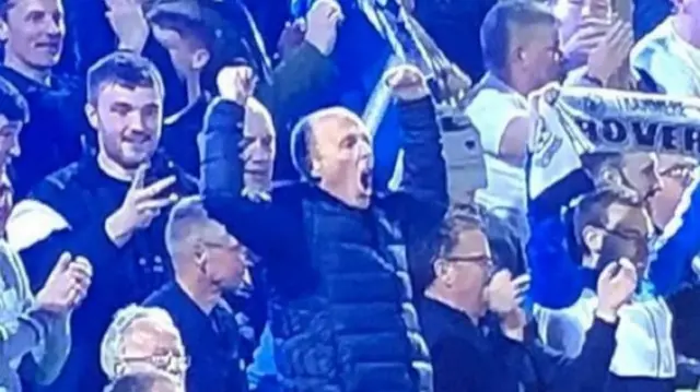 Mike Dean celebrates