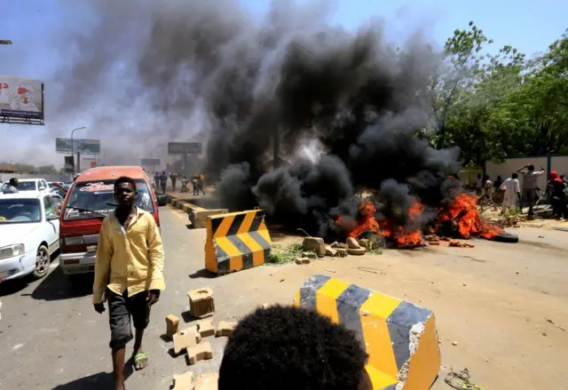 Sudanese protesters burn tyres and barricade the road leading to al-Mek Nimir Bridge crossing over Blue Nile; that links Khartoum North and Khartoum, in Sudan May 13, 2019