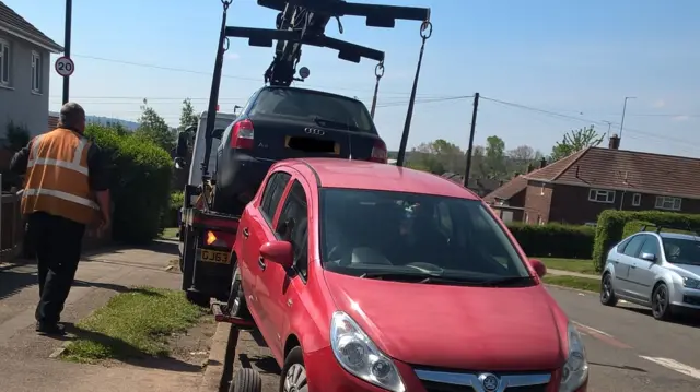 Car being towed away