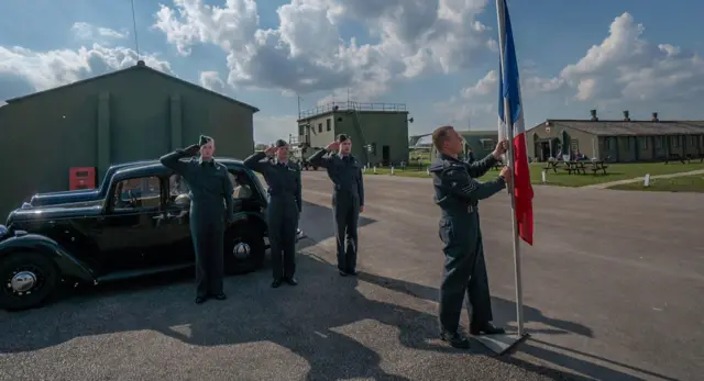 Crew raises flag