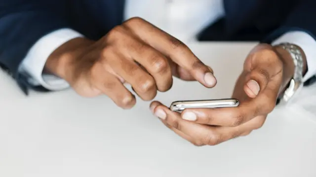 A man uses his smartphone