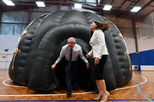 Scott Morrison emerges from an inflatable tent in New South Wales earlier this month.