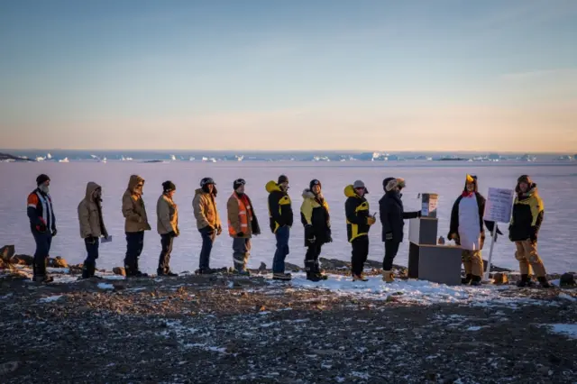 Expeditioners line up to vote at Davis research station in Antarctica