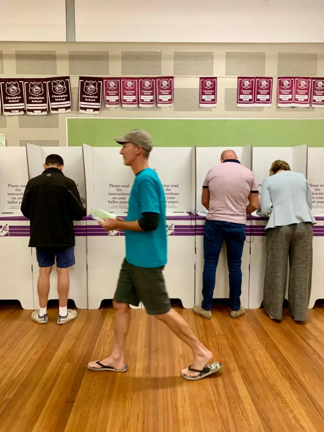 Zali Steggal (right) and her husband voting