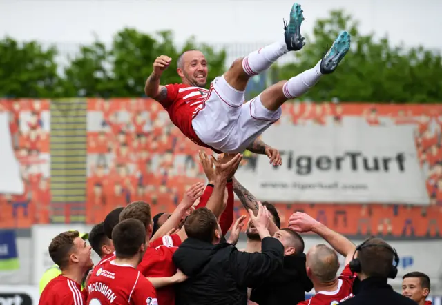 Hamilton Accies players celebrate with retiring captain Dougie Imrie