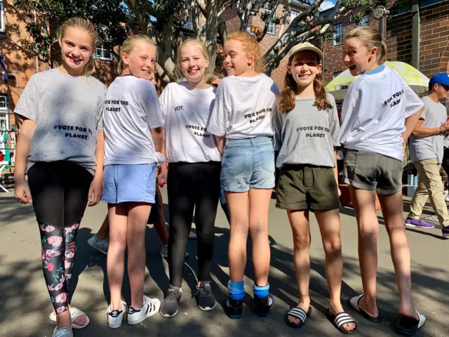 Children wearing climate change protest tshirts in Sydney