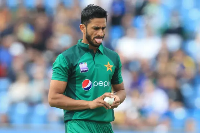 Hasan Ali gestures as he prepares to bowl