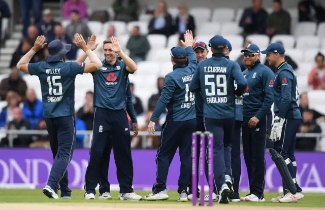 Chris Woakes celebrates taking the wicket of Fakhar Zaman of Pakistan