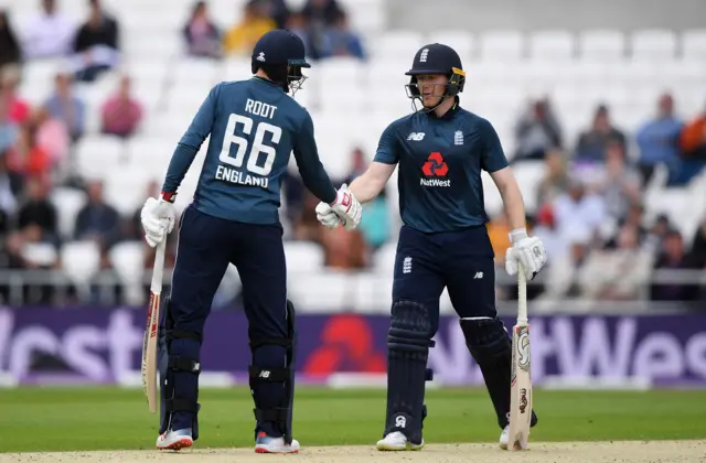 Joe Root and Eoin Morgan of England shake hands