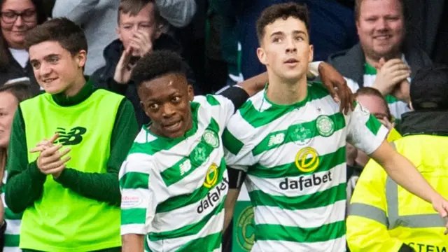 Celtic’s Mikey Johnston (right) celebrates his second goal with Karamoko Dembele