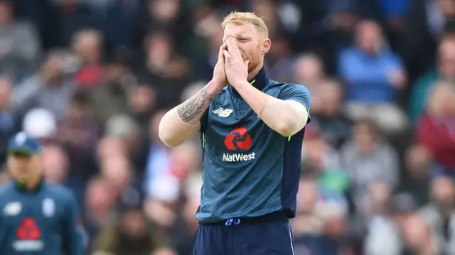 Ben Stokes of England reacts after being hit for four runs