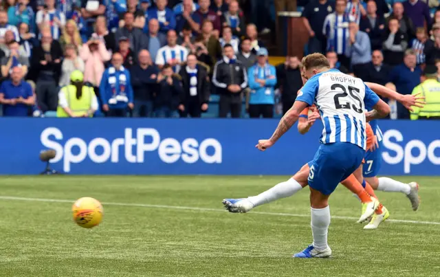 Eamonn Brophy slams in the winning penalty at Rugby Park