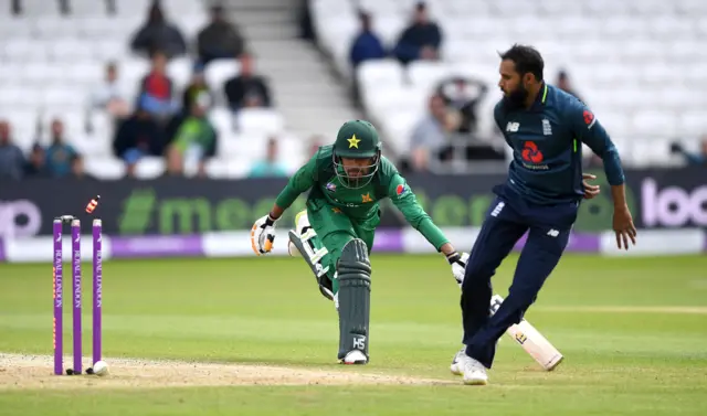 Babar Azam of Pakistan is run out by Adil Rashid of England