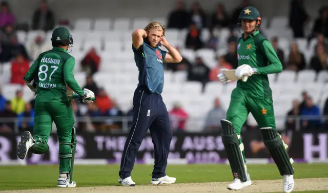 David Willey of England looks on dejected