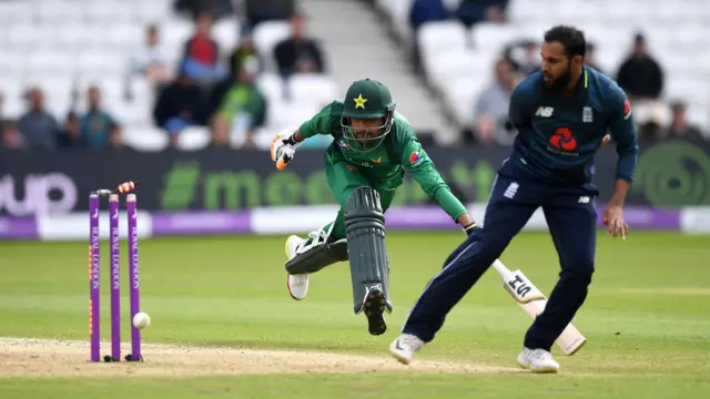 Babar Azam of Pakistan is run out by Adil Rashid of England