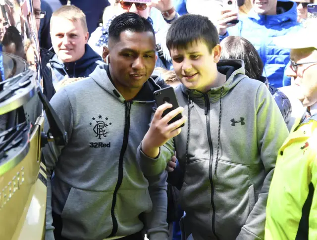 Alfredo Morelos poses for a selfie with a fan at Rugby Park