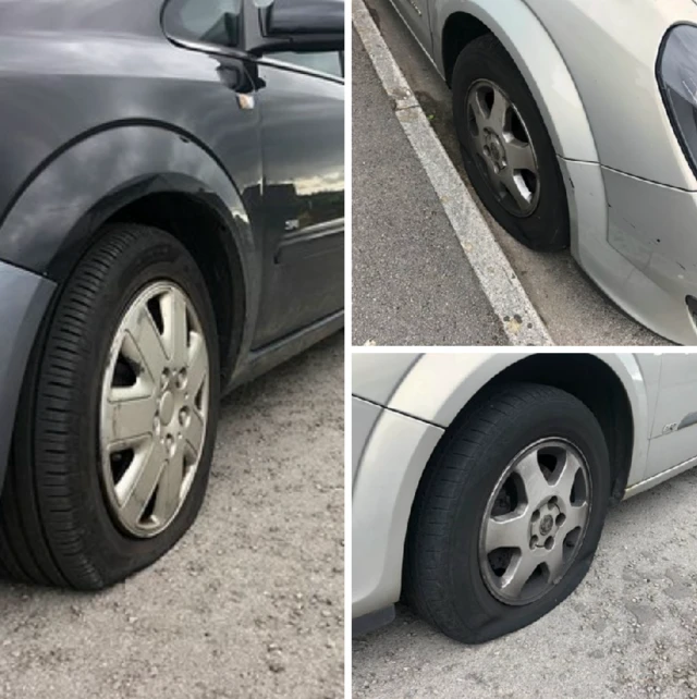 Tyres that have been let down on three cars.