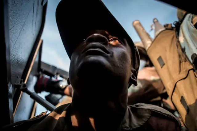 A soldier from the Armed Forces of the Democratic republic of the Congo is seen on patrol to hold off attacks from ADF rebels on 6 October 2018, outside Oicha.