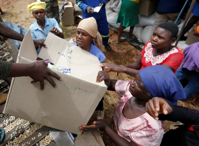 Victims of Cyclone Idai receive food aid at Siverstream Estates in Chipinge, Zimbabwe March 24 ,2019.