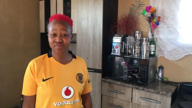 Mponeng Mofokeng stands in her kitchen