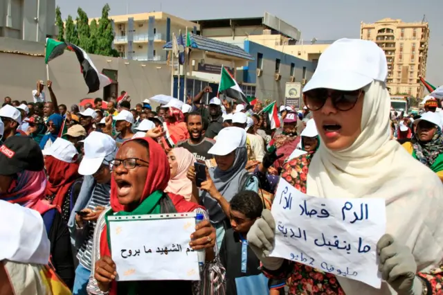 Sudanese demonstrators chant slogans as they gather during a demonstration outside the army headquarters in Khartoum on 2 May 2019.