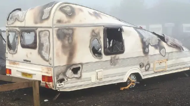 Burned out caravan