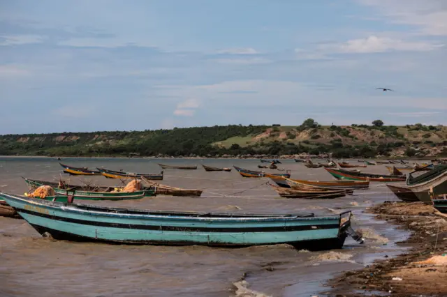 Fishing boats sit on the water of Lake Albert by the UNHCR landing site for refugee arrivals from the Democratic Republic of Congo on April 4, 2018 in Sebagoro, Uganda.