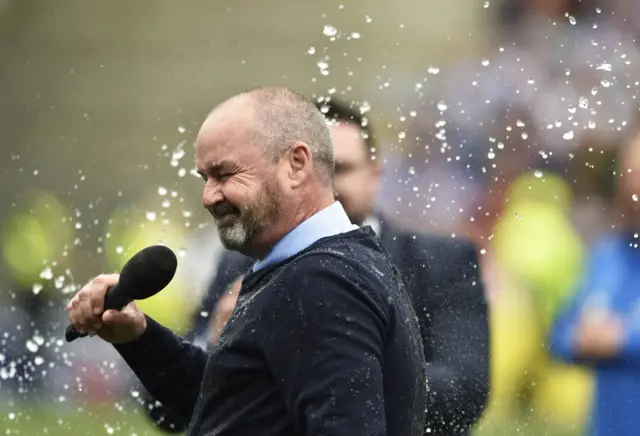 Steve Clarke gets covered by champagne at Rugby Park