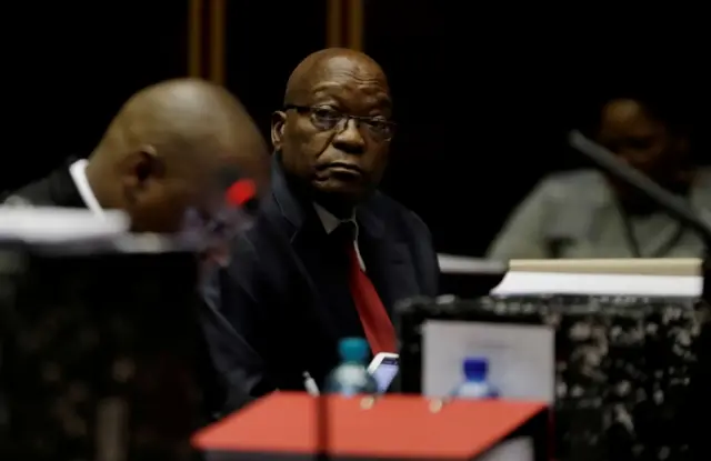 Former South African President Jacob Zuma sits in court, facing charges that include fraud, corruption and racketeering in Pietermaritzburg, South Africa, May 20, 2019.