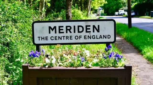 The Meriden village sign