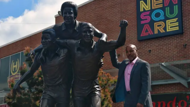 The unveiled statue with Brendon Batson