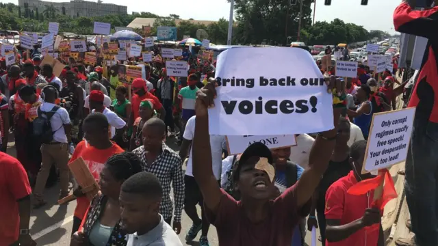 Protesters take to the streets in Accra with placards