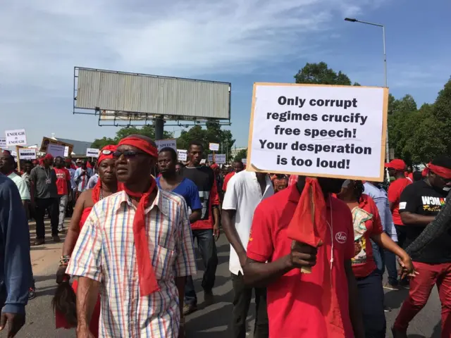 Protesters take to the streets in Accra with placards