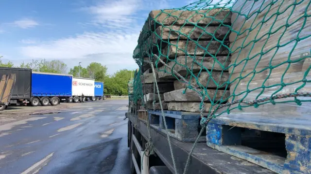 A lorry carrying some stone