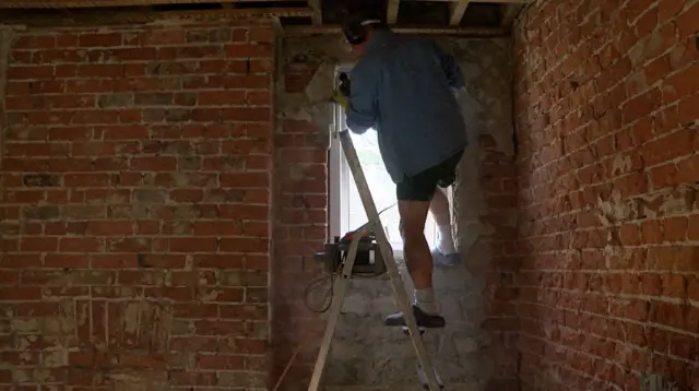 Andrew Munro in the process of building his home