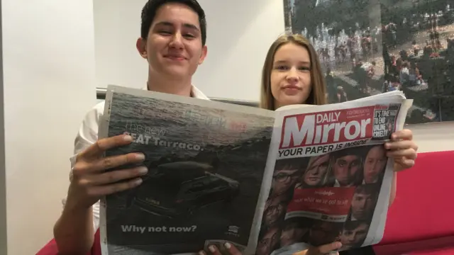 Two of the editors with the paper