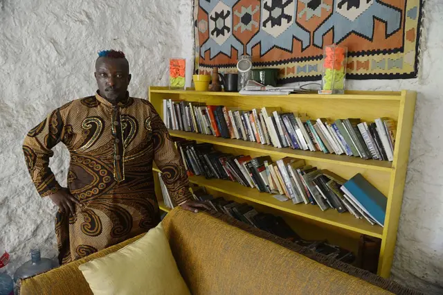 Kenyan author Binyavanga Wainaina poses during an interview with the AFP on January 27, 2014, in Nairob