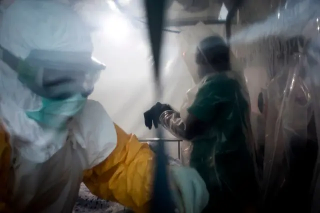 Two medical workers in protective gear