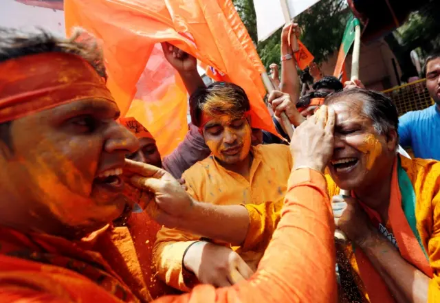 BJP supporters outside party headquarters in New Delhi.