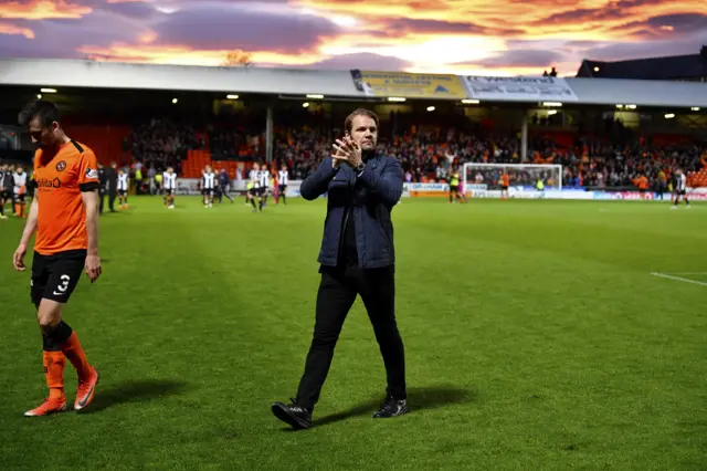 Dundee United head coach Robbie Neilson applauds the fans