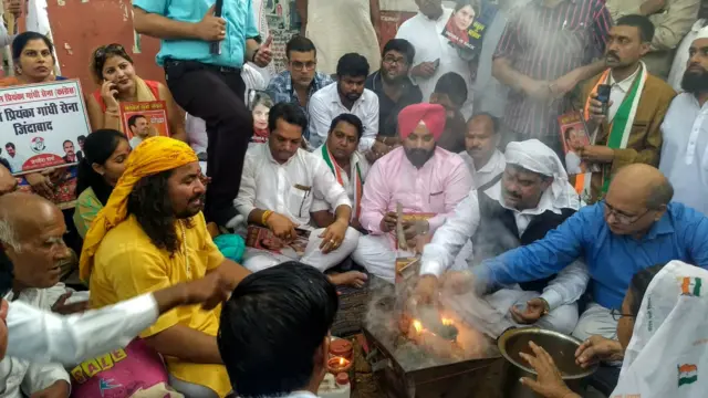 Congress party workers offering prayer