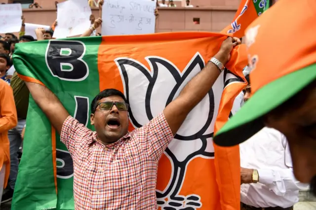 A BJP supporter outside the party headquarters in New Delhi.