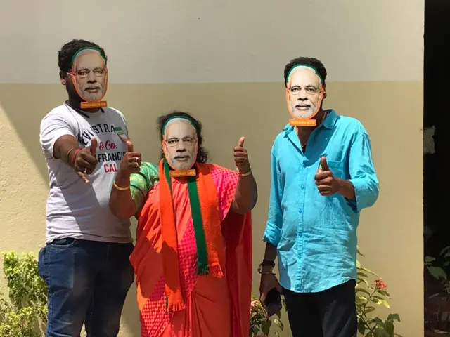 BJP supporters wearing Modi masks