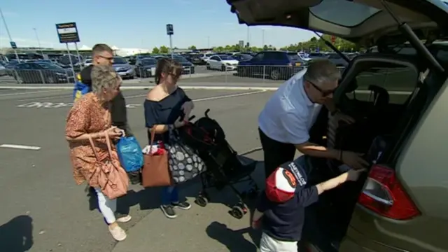 Passengers at airport drop-off