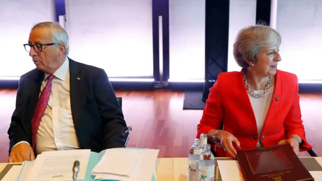 Britain"s Prime Minister Theresa May and European Commission President Jean-Claude Juncker attend the European Union leaders informal summit in Salzburg, Austria