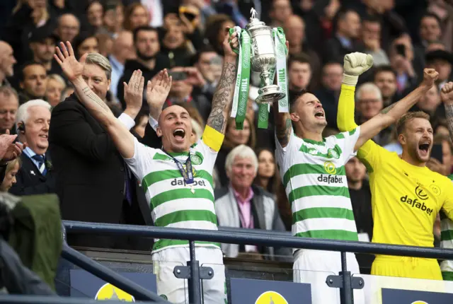 Celtic's Scott Brown and Mikael Lustig lift the Scottish Cup