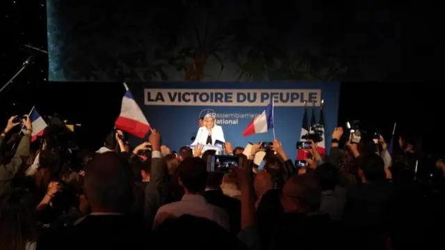 Marine Le Pen is greeted by enthusiastic supporters in Paris