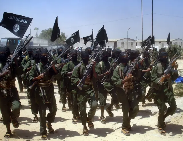 A file photo taken on February 17, 2011 shows Islamist fighters loyal to Somalias Al-Qaida inspired al-Shebab group performing military drills at a village in Lower Shabelle region, some 25 kilometres outside Mogadishu. A top leader of Somalia"s Al-Qaeda-affiliated Shebab rebels, intelligence chief Zakariya Ismail Ahmed Hersi, has surrendered to government and African Union forces and is now in custody, officials said on December 27, 2014.