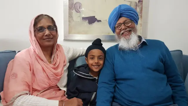 Surinderpal Singh Rai with his wife and grandson